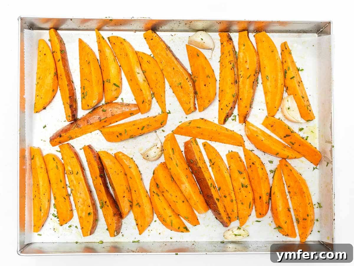 Crispy Sweet Potato Wedges 7 sweet potato wedges arranged on baking sheet