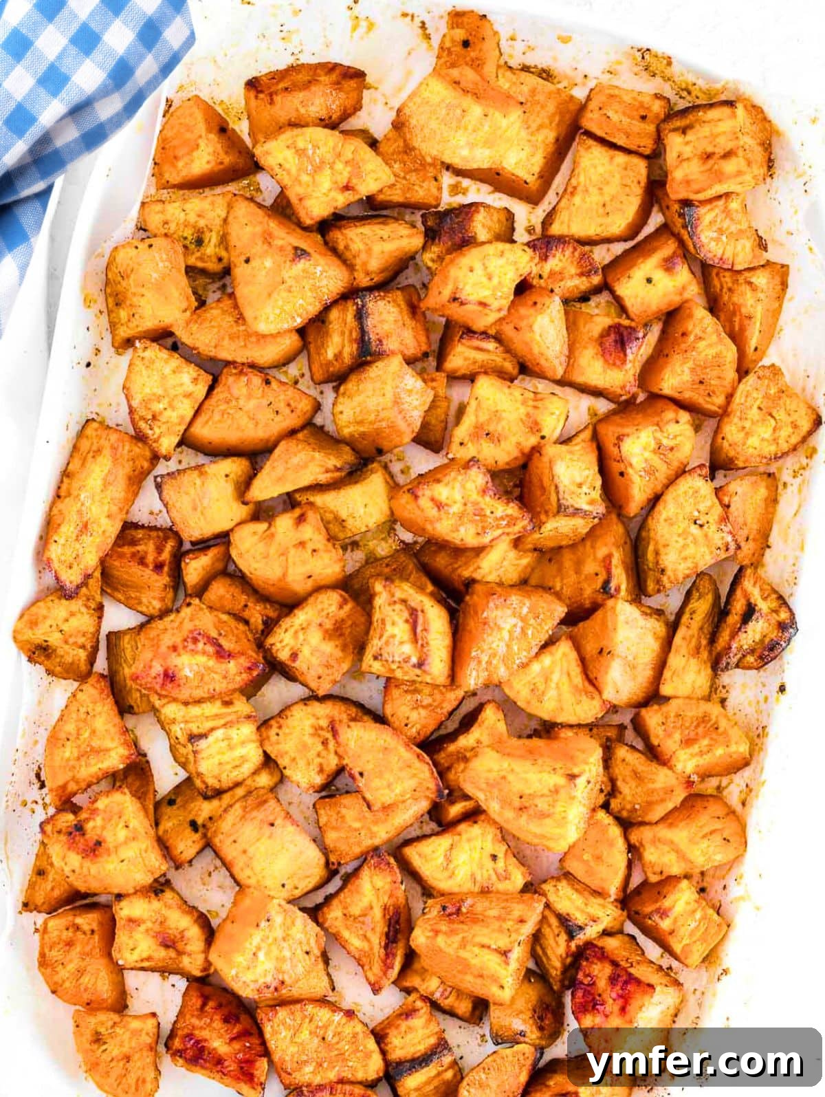 Golden Roasted Sweet Potatoes 2 roasted sweet potatoes on a platter