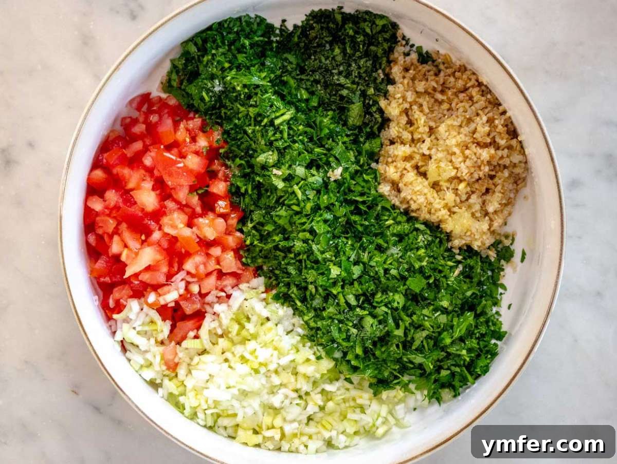 Fresh and Zesty Tabbouleh Salad 6 Finely chopped fresh parsley, diced tomatoes, and sliced scallions are added to a large mixing bowl with the prepared bulgur, ready for seasoning.