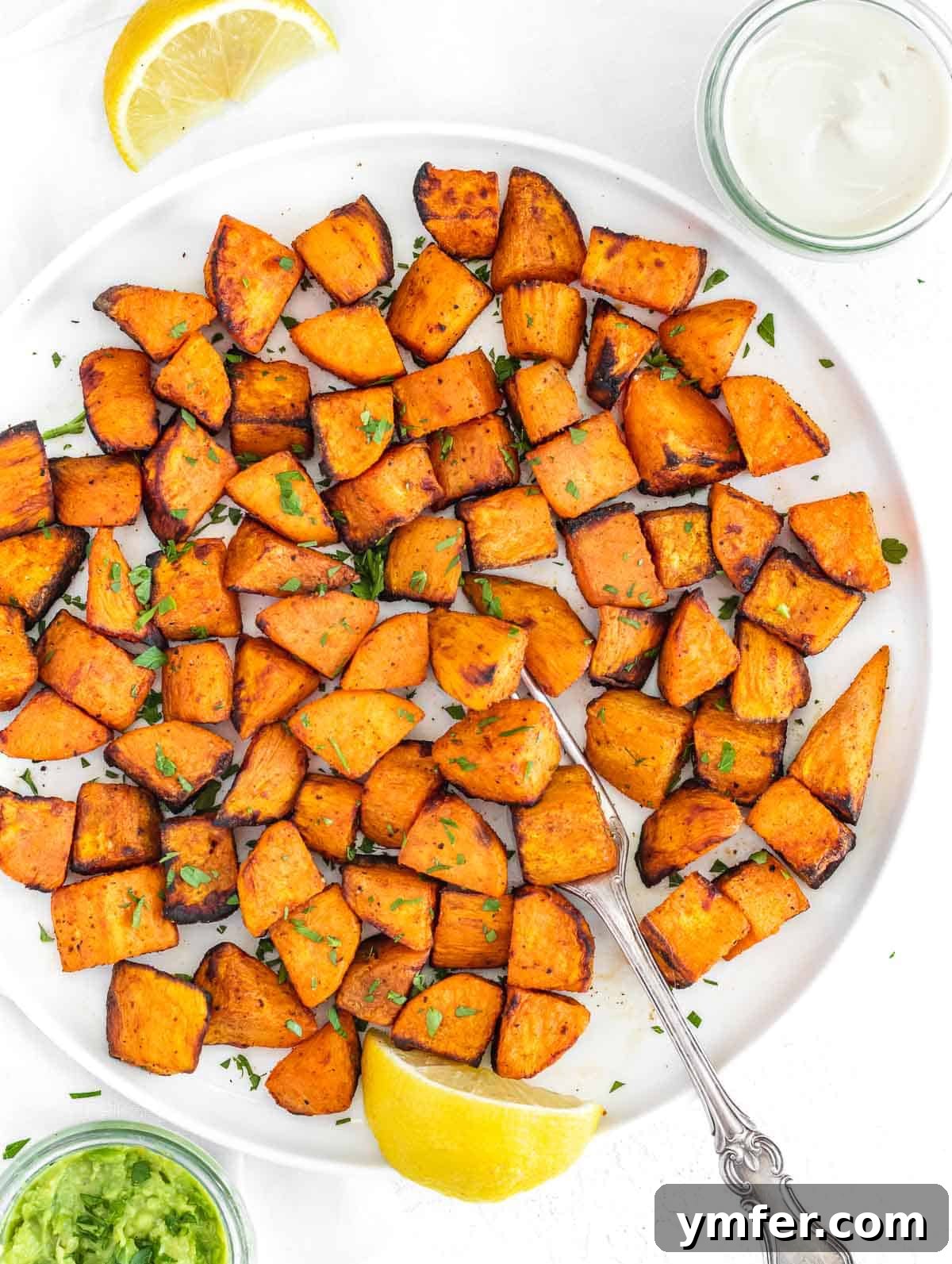 Golden & Crispy Air Fryer Sweet Potatoes 2 Perfectly roasted air fryer sweet potato cubes in a bowl, ready to serve.