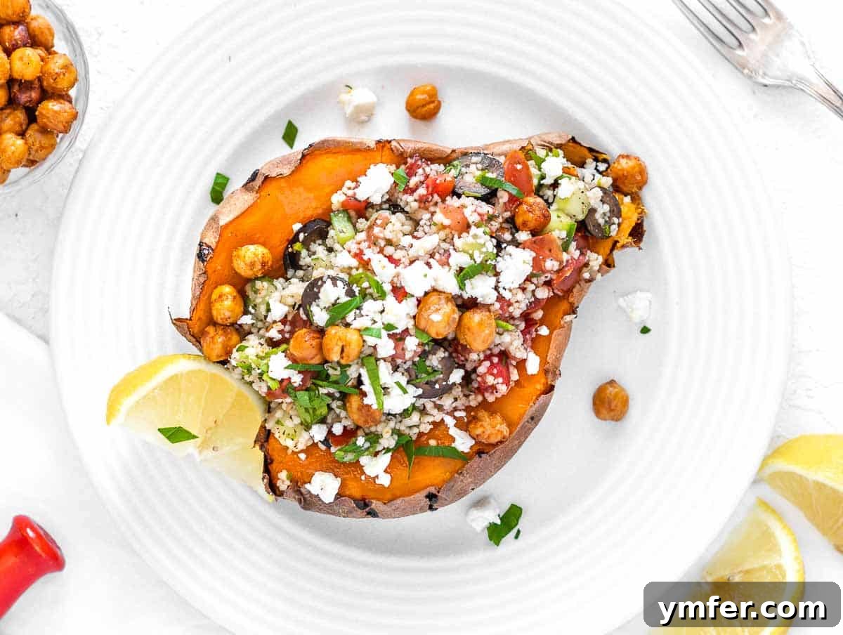 Golden & Crispy Air Fryer Sweet Potatoes 14 Baked sweet potato with a topping of couscous, crumbled feta, chickpeas, and sliced olives.
