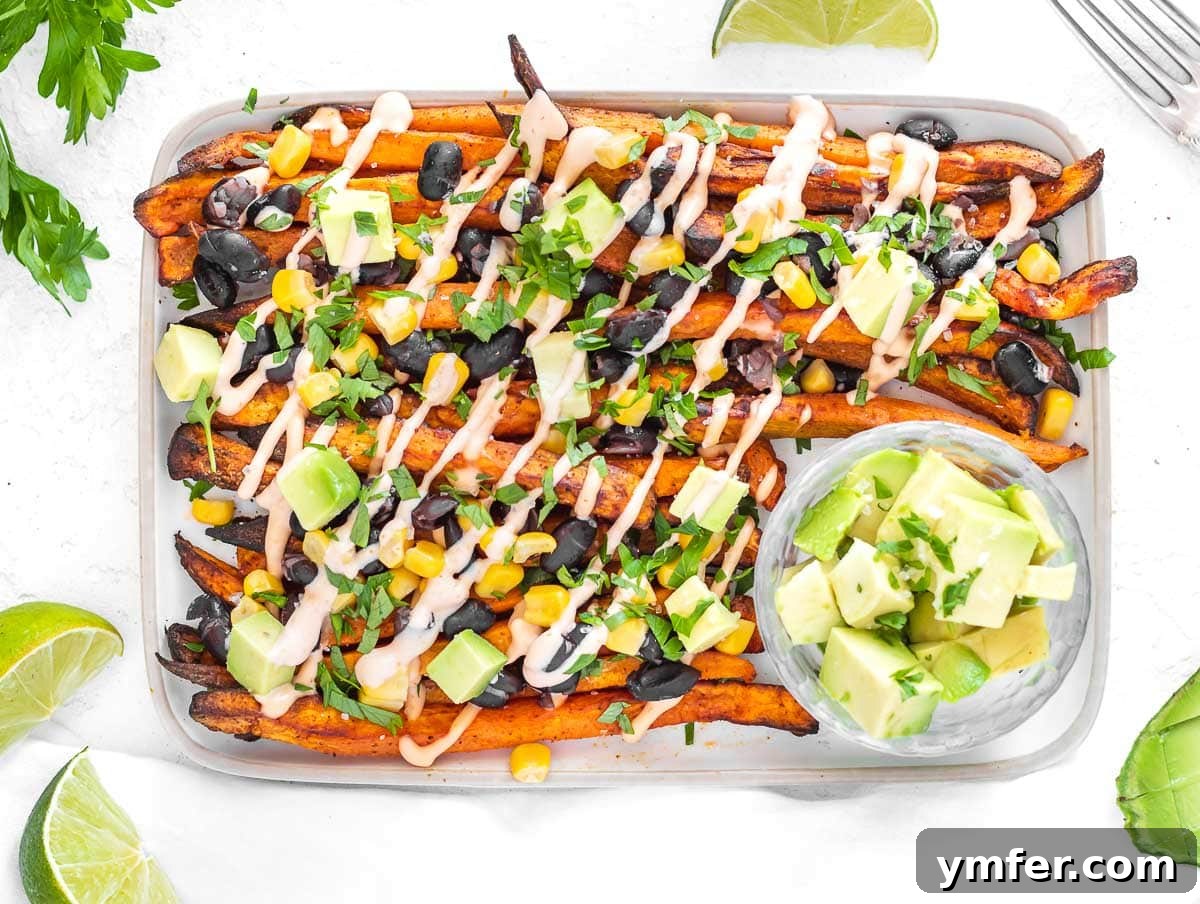 Golden & Crispy Air Fryer Sweet Potatoes 20 Loaded sweet potato fries topped with beans, corn, cilantro, and avocado.