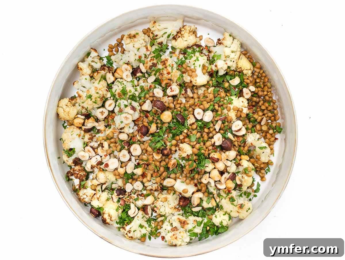 Hearty Lentil & Cauliflower Bowl 10 large bowl with all ingredients for cauliflower lentil salad