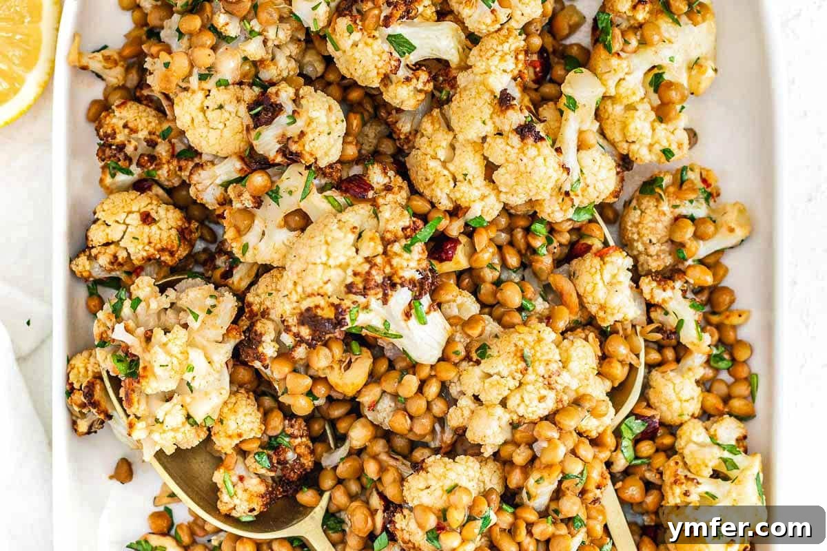 Hearty Lentil & Cauliflower Bowl 3 Cauliflower lentil salad with parsley on a white platter
