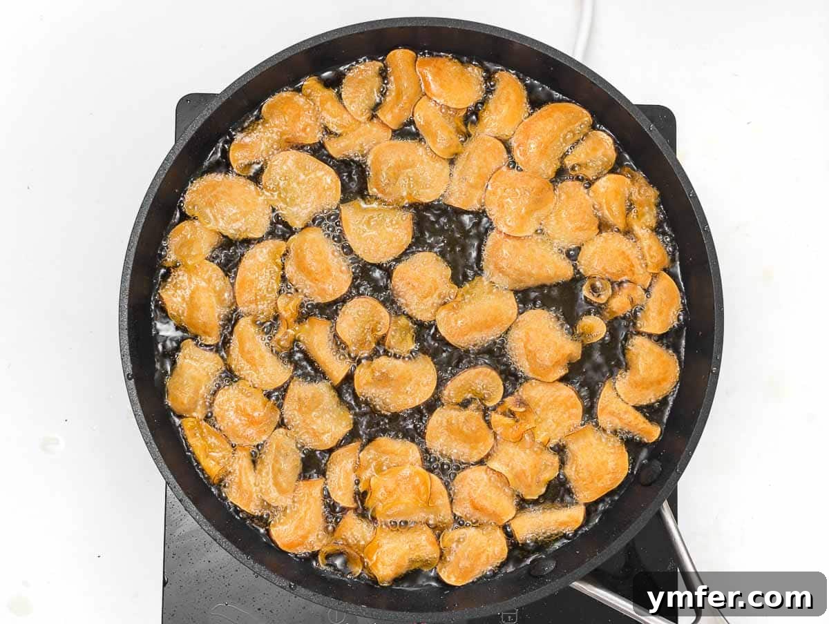 Artisan Sweet Potato Crisps 15 frying sweet potato chips in hot oil