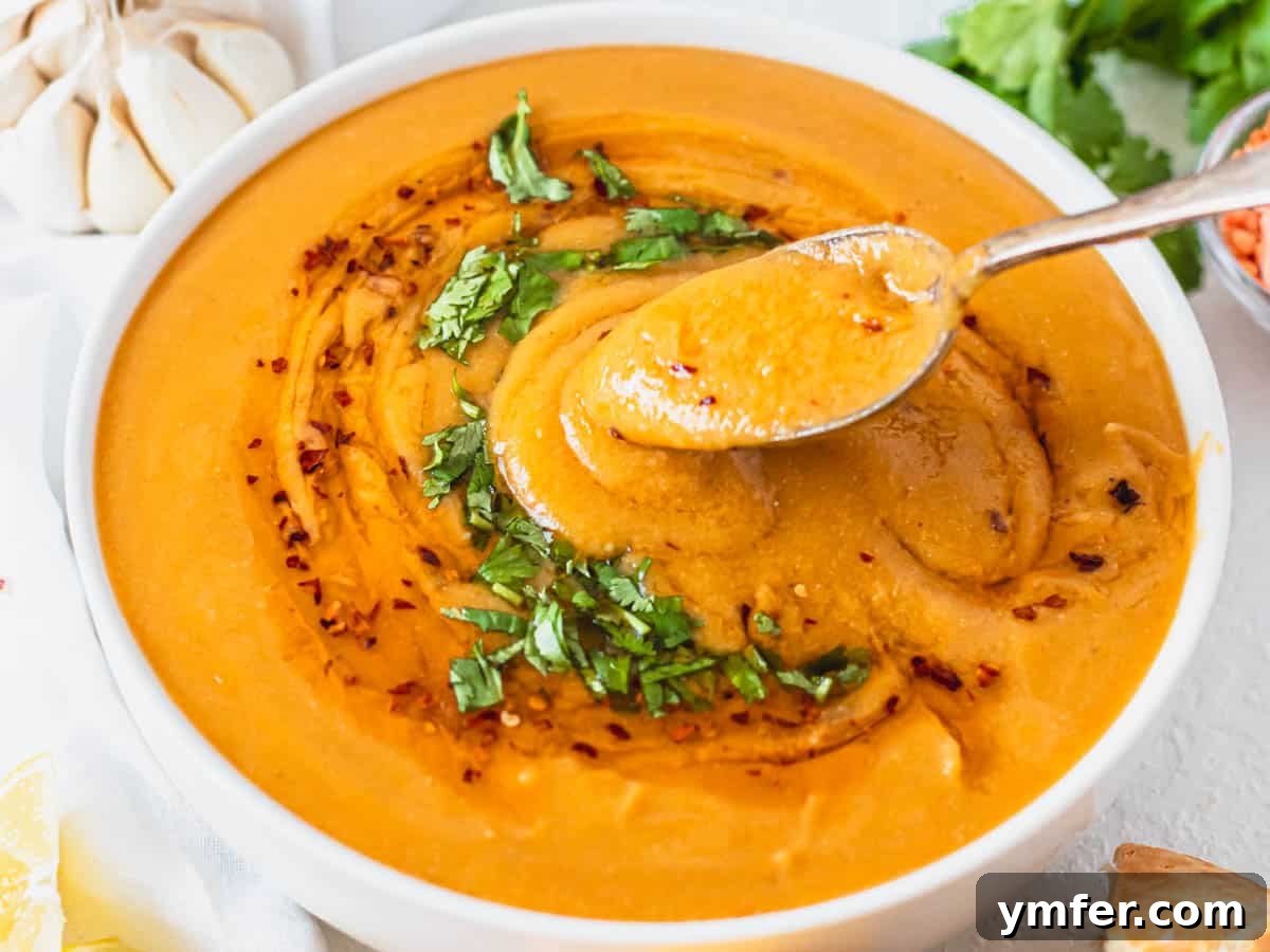 Hearty Lentil Harvest 30 Wholesome Recipes 20 Turkish red lentil soup garnished with fresh parsley and a swirl of chili oil.