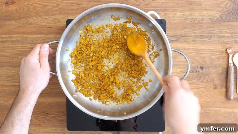 Hearty Lentil Harvest 30 Wholesome Recipes 28 Toasting a vibrant blend of curry powder, cumin, chili flakes, coriander, turmeric, garam masala, and pepper.