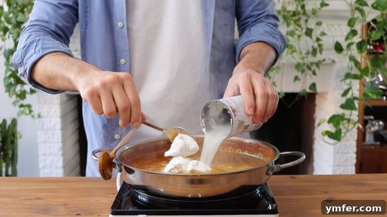 Hearty Lentil Harvest 30 Wholesome Recipes 30 Stirring in creamy coconut milk to finish the lentil curry.