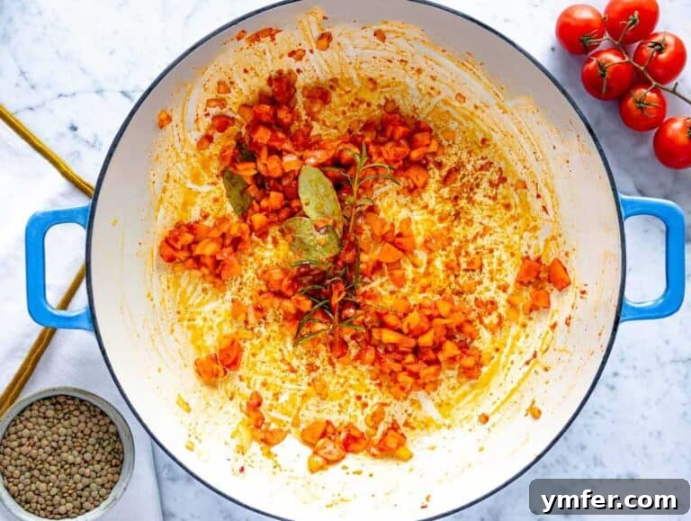 Plant-Powered Pasta 9 Making the flavor base with onion, carrot, and tomato paste in a skillet.