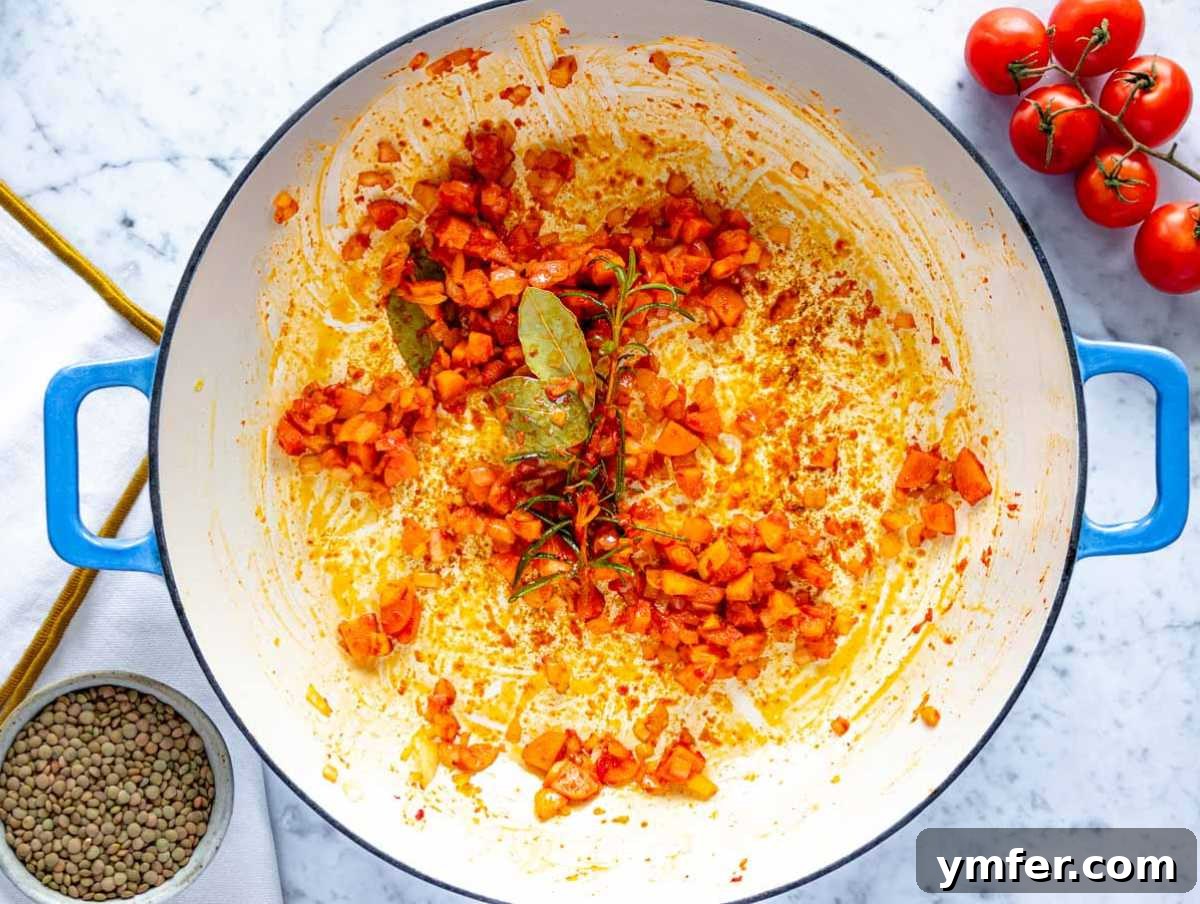 Plant-Powered Pasta 4 Making the flavor base with onion, carrot, and tomato paste in a skillet.