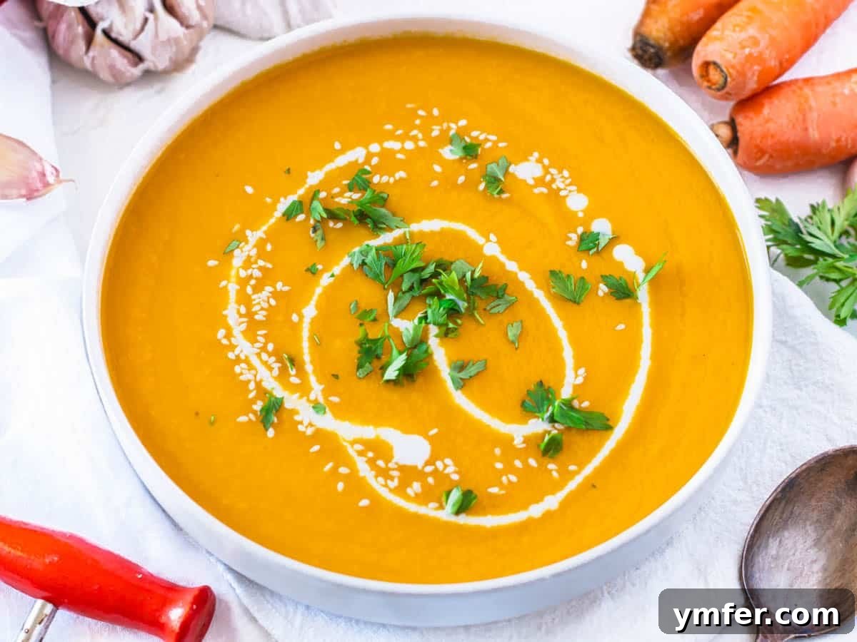 30 Simple Soup Solutions 13 Carrot soup garnished with fresh parsley and a swirl of coconut milk