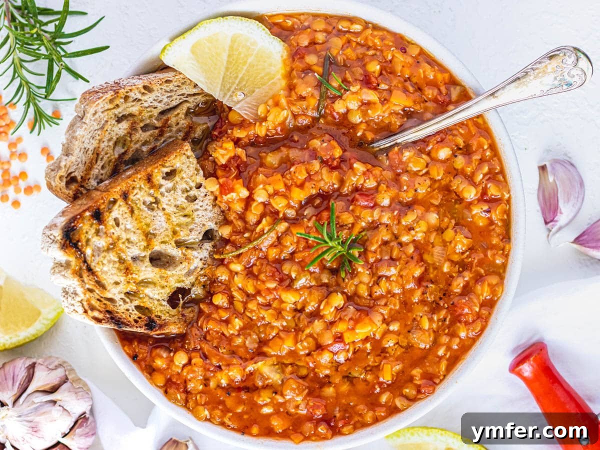30 Simple Soup Solutions 14 Red lentil soup served with garlic bread, lemon, and rosemary