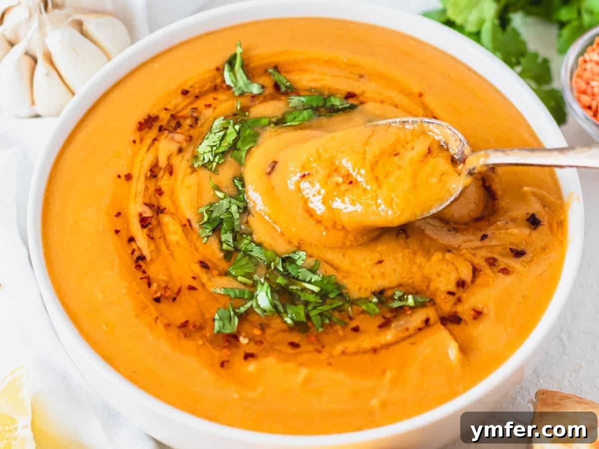 30 Simple Soup Solutions 18 Turkish red lentil soup garnished with fresh parsley and a swirl of chili oil