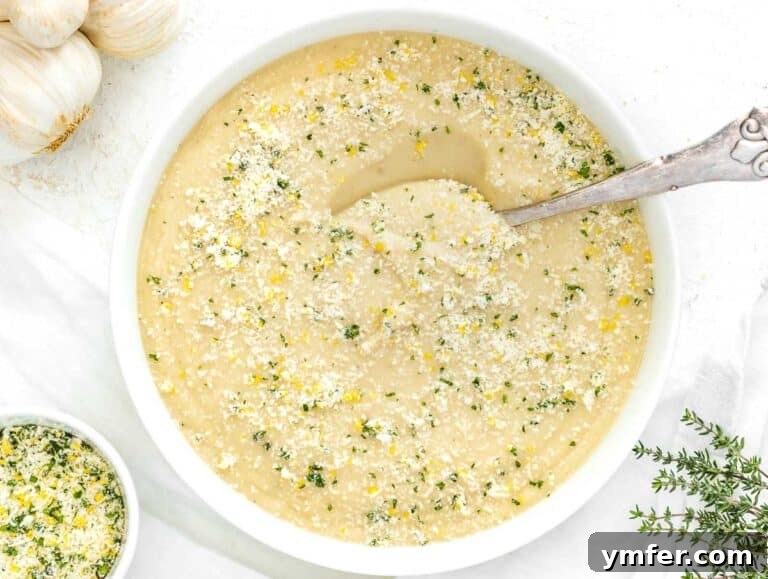 Cauliflower soup served with a topping of parmesan gremolata