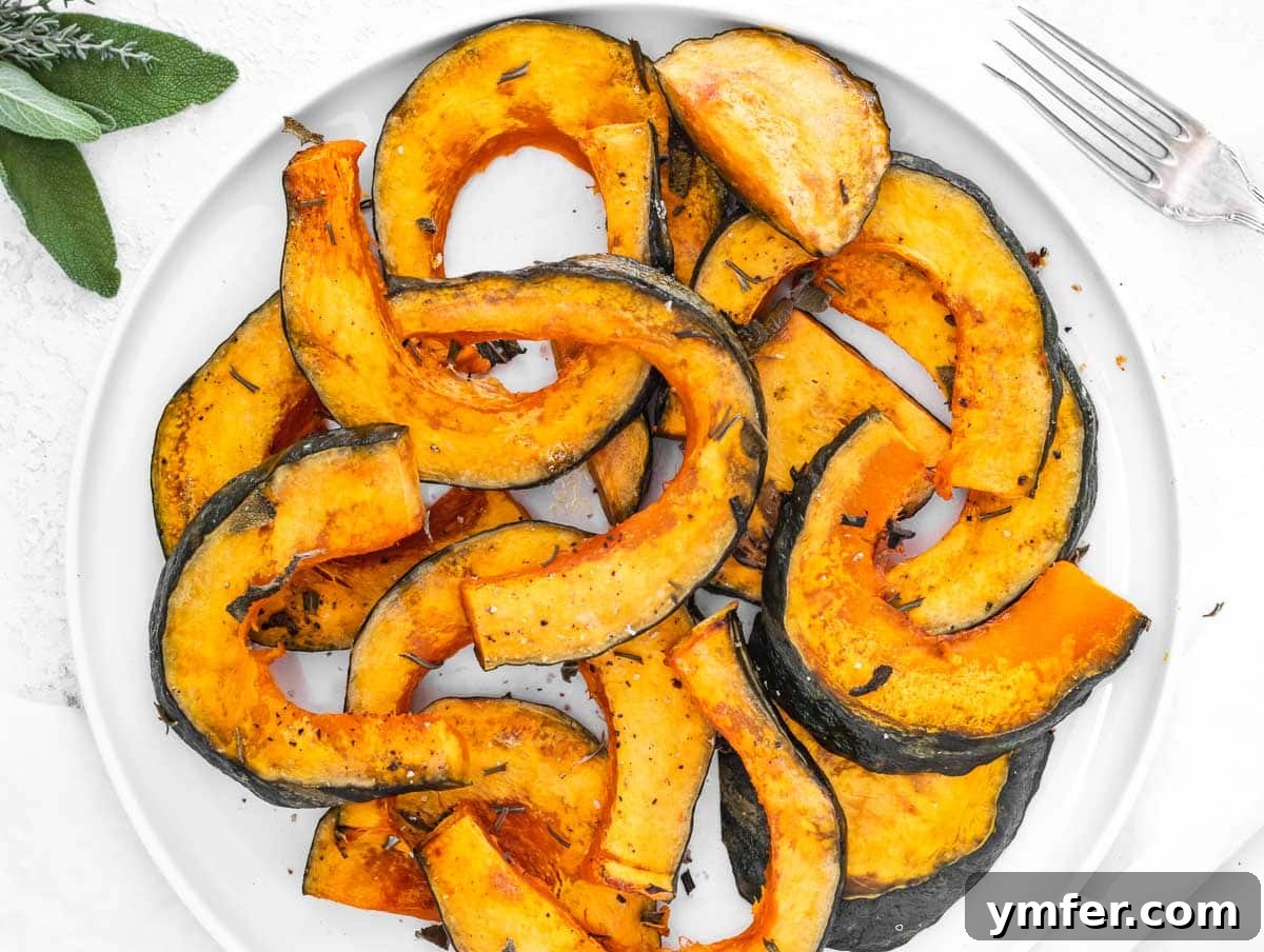 Golden Roasted Kabocha 5 A close-up shot of fork-tender roasted winter squash, perfectly golden and ready to be served on a pristine white plate.