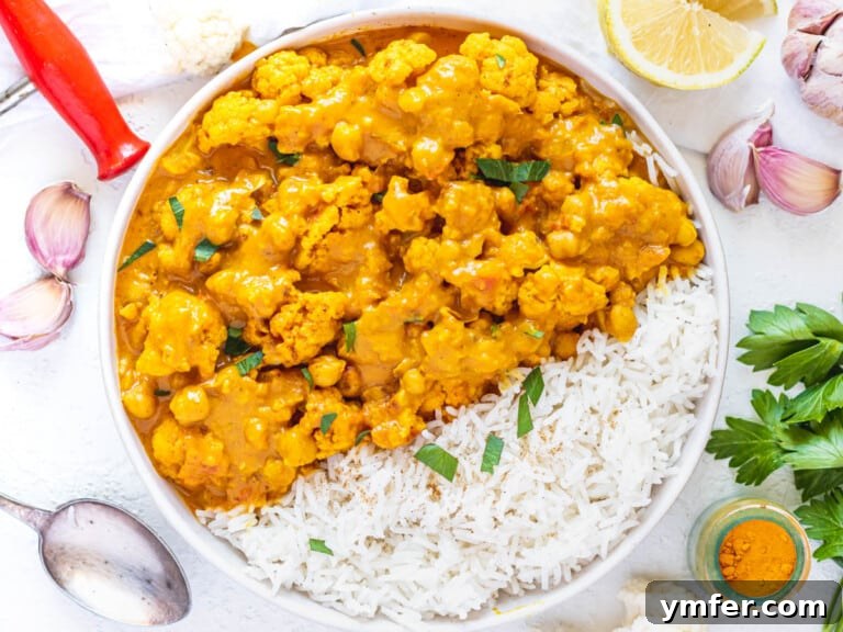Cauliflower Curry served with basmati rice in a bowl.