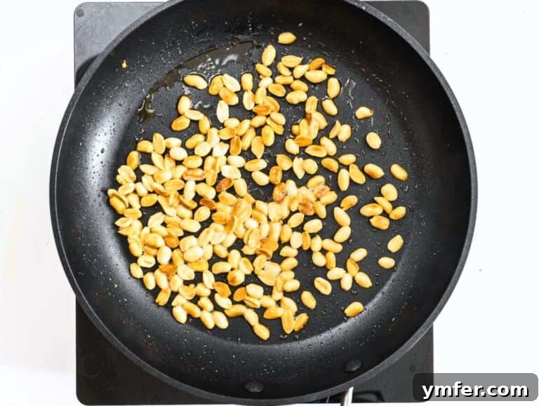 Kung Pao Tofu 15 Toasted peanuts in a pan.