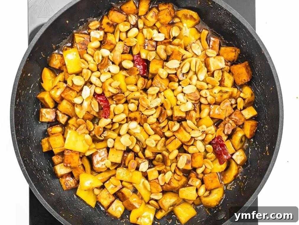 Kung Pao Tofu 9 Adding toasted peanuts to the finished Kung Pao Tofu and veggies.