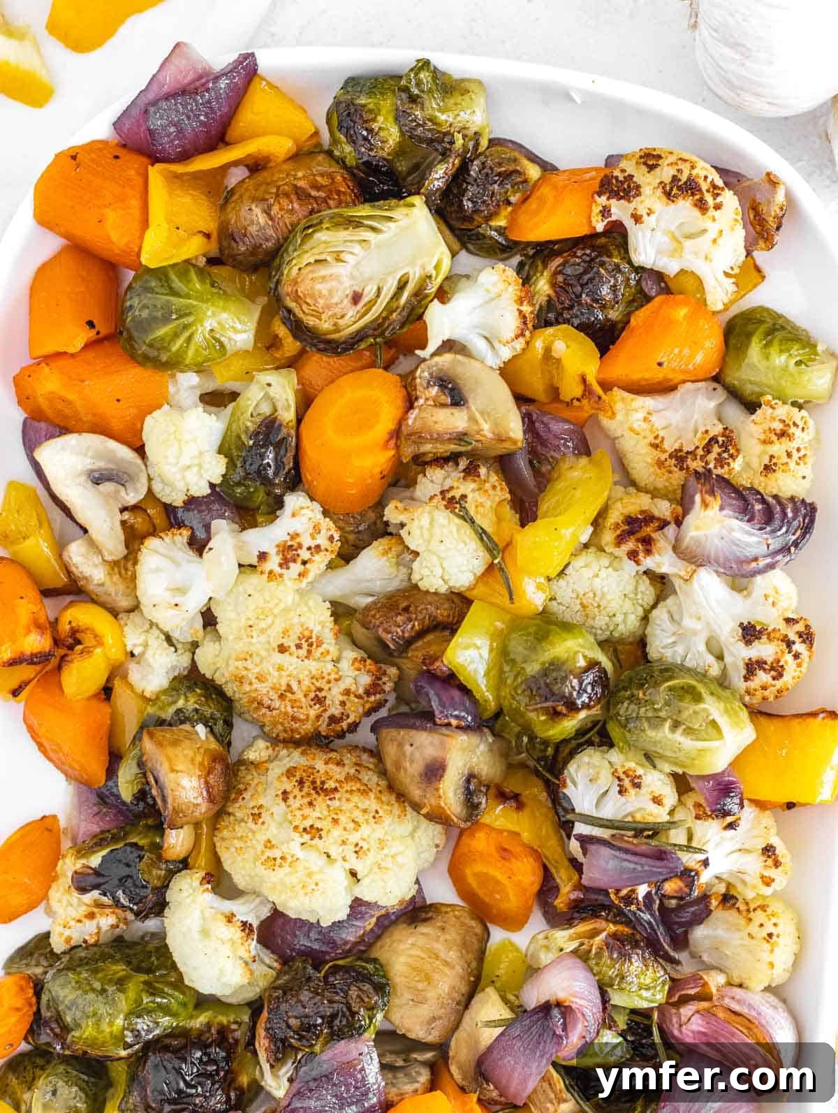 Sheet Pan Roasted Delights 2 Roasted vegetables on a white platter, beautifully arranged and ready to serve