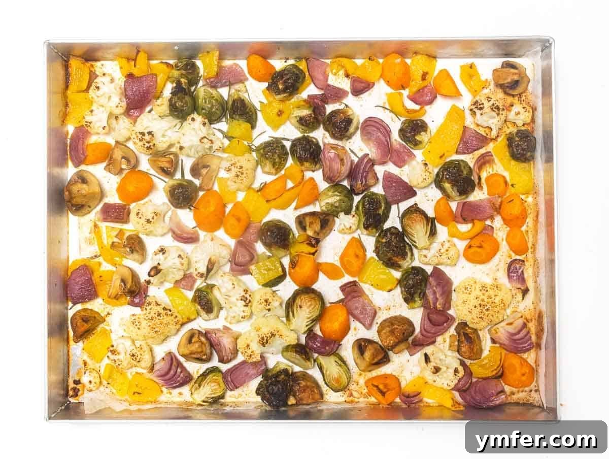 Sheet Pan Roasted Delights 8 Roasted vegetables, golden brown and slightly charred, fresh out of the oven