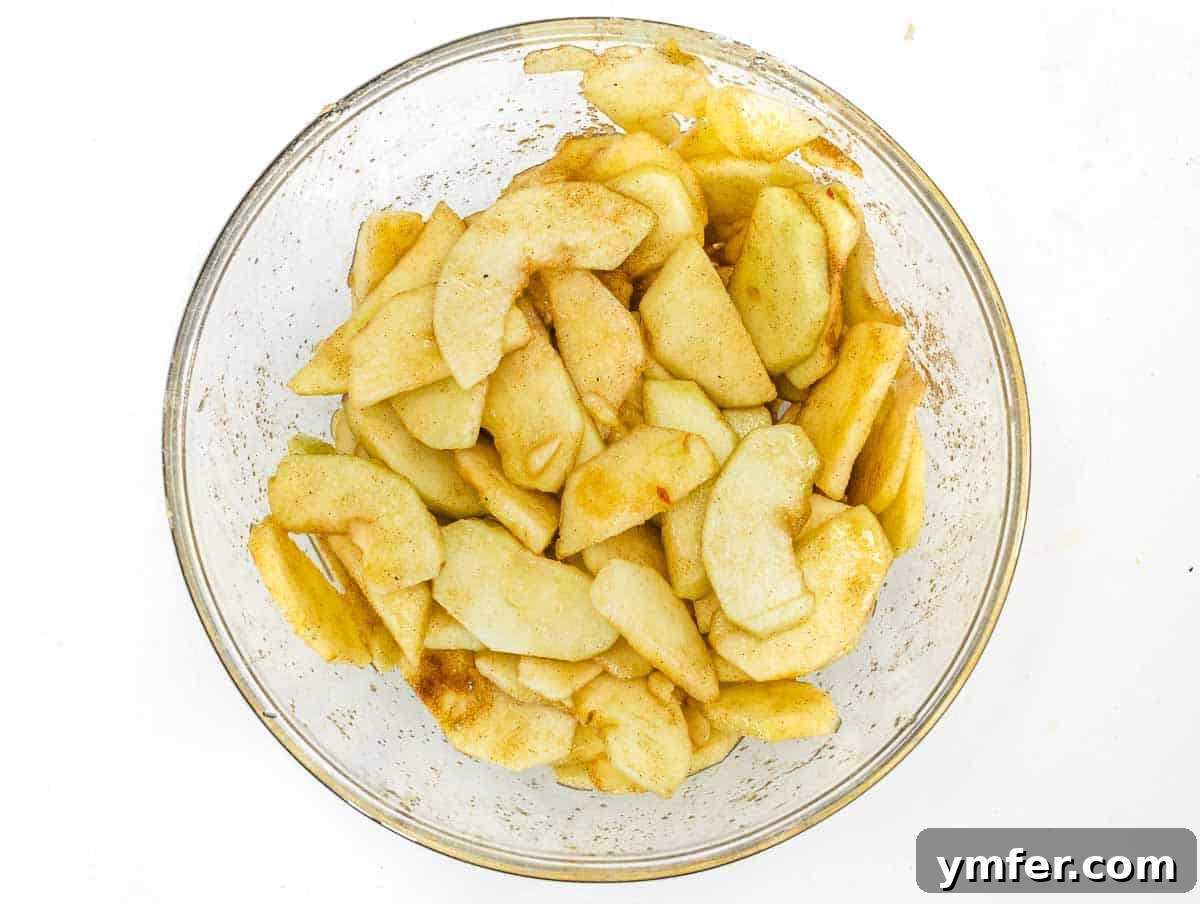 apple slices with sugar and cinnamon, ready for the tart
