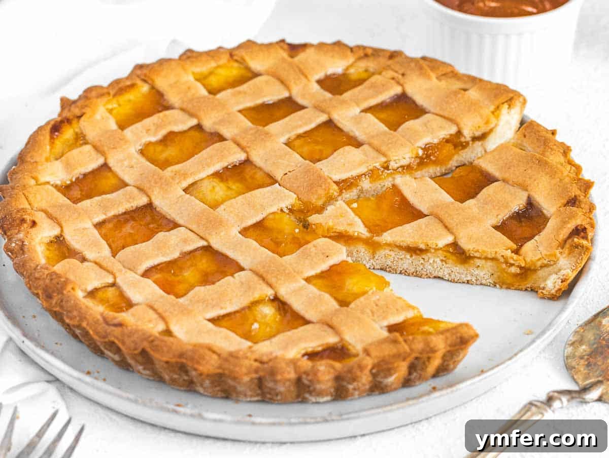 Crostata with slice, a cozy Italian jam tart
