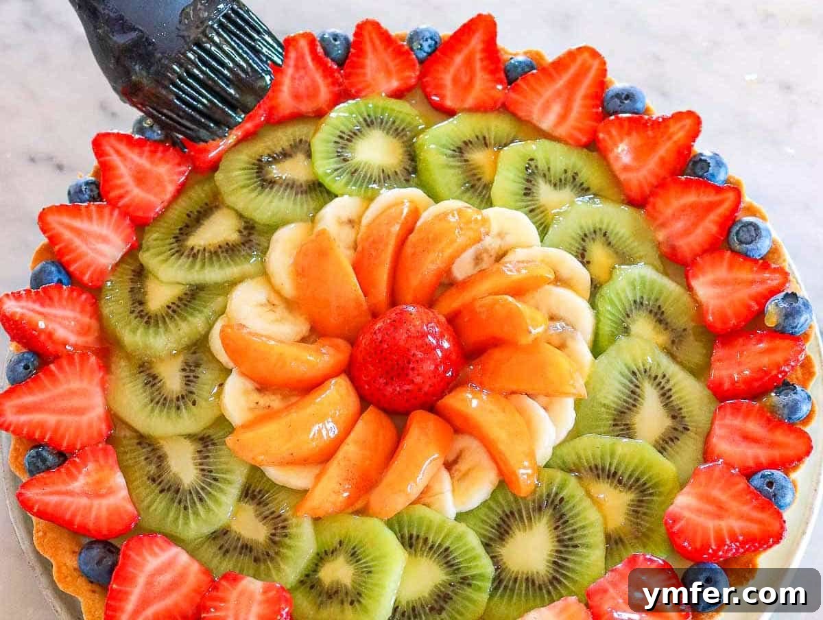 fruit tart, adorned with fresh seasonal fruits