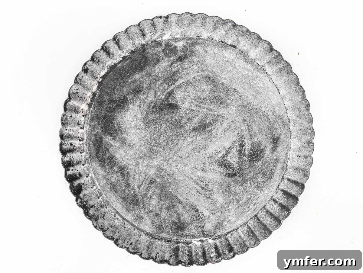 tart pan with removable bottom, prepared for dough