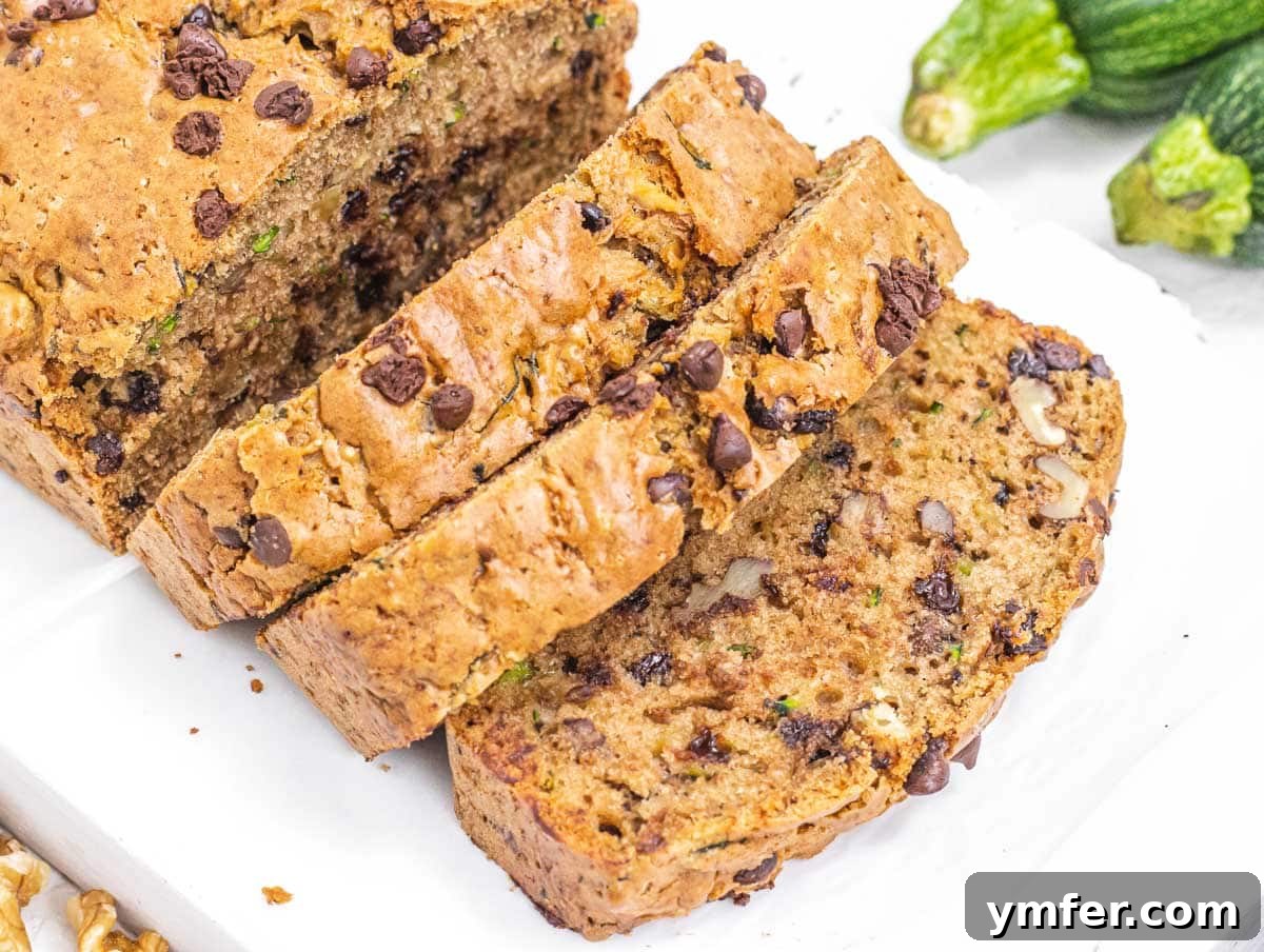 35 Effortless Dessert Delights 7 Vegan Zucchini Bread cut into slices, a wholesome and moist baked good