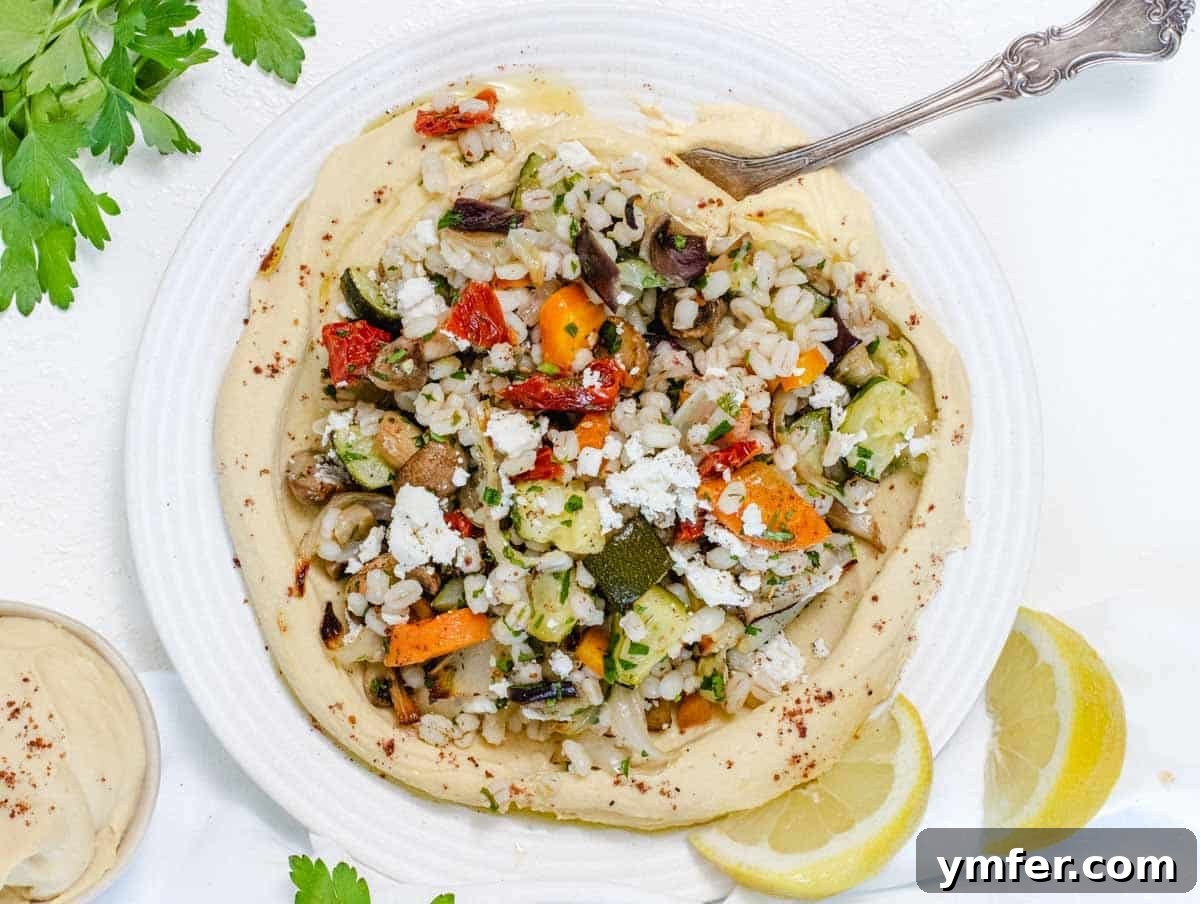 Hearty Barley Salad 12 Barley salad on a bed of hummus