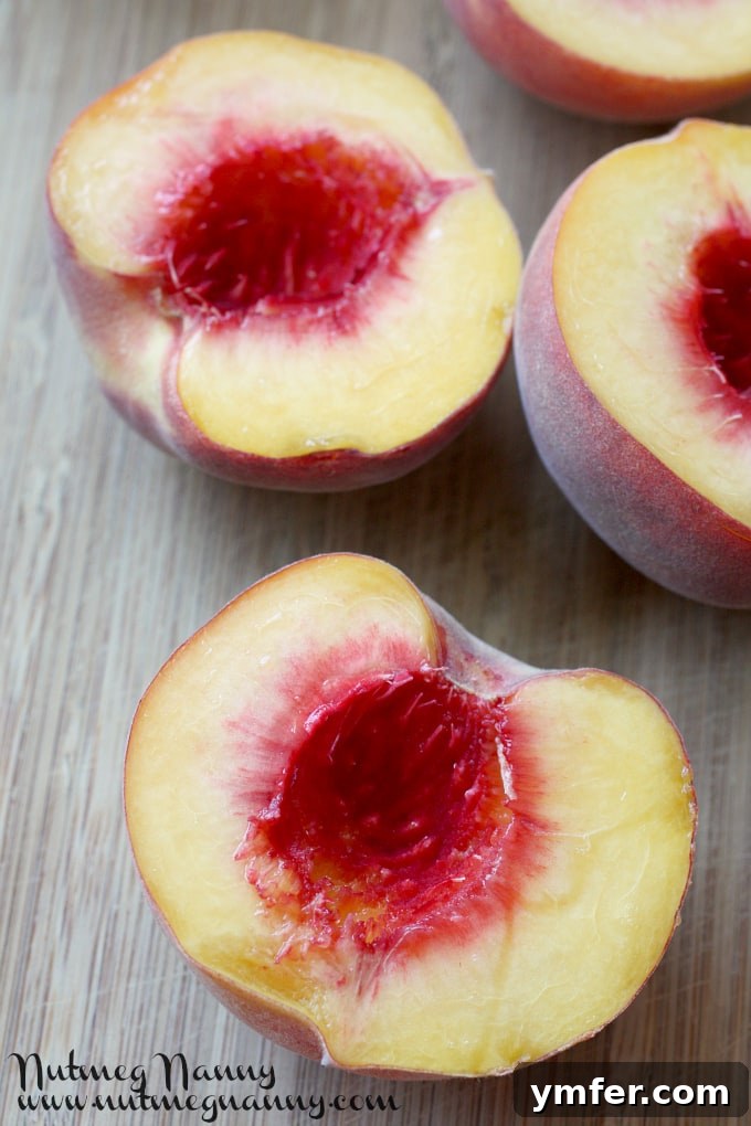Grilled Peaches with Brown Sugar Sauce by Nutmeg Nanny Platter of grilled peaches showing beautiful char marks, ready for sauce