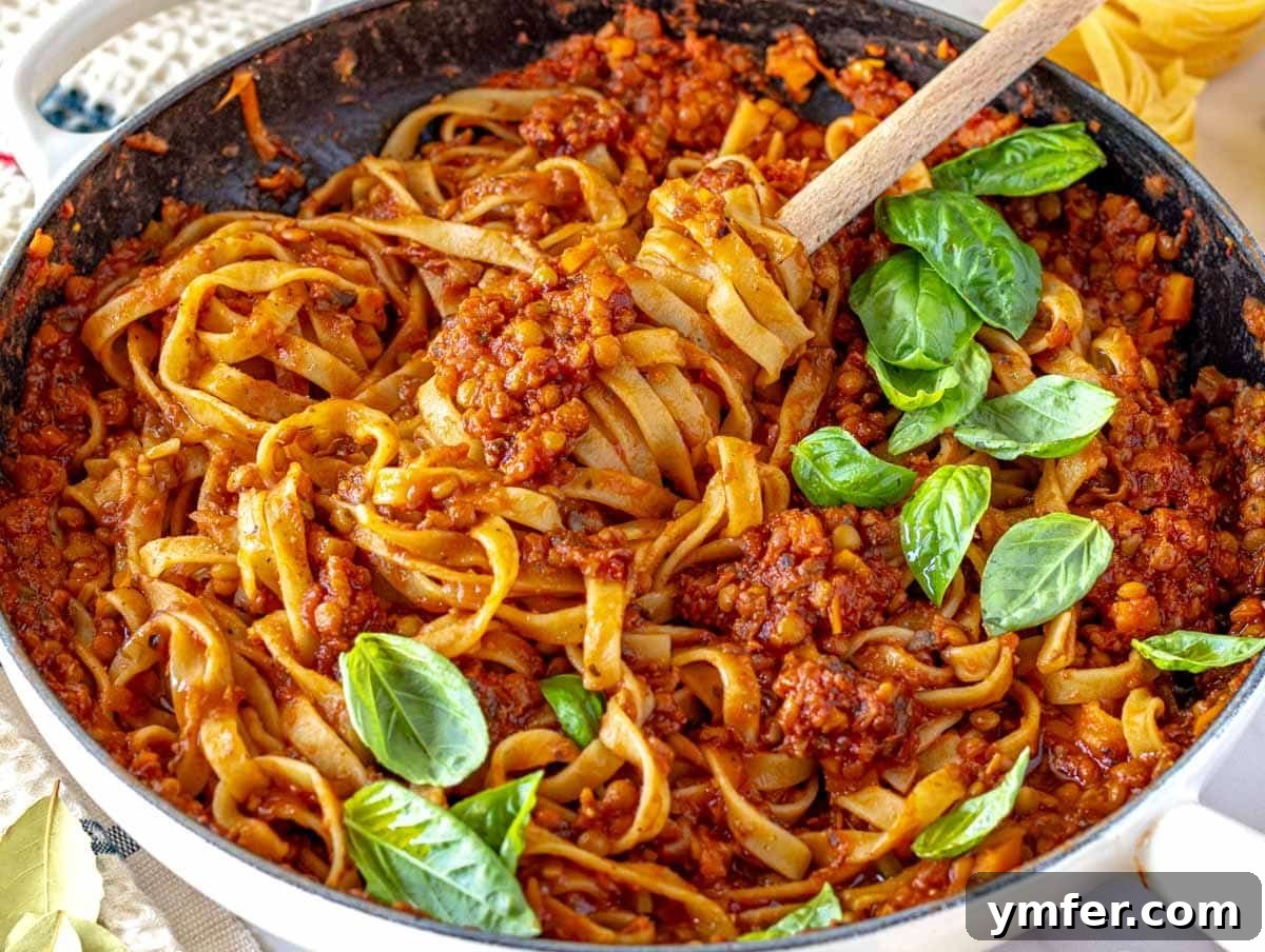 45 Effortless Vegetarian Dinner Ideas 10 lentil bolognese with pasta in a white skillet
