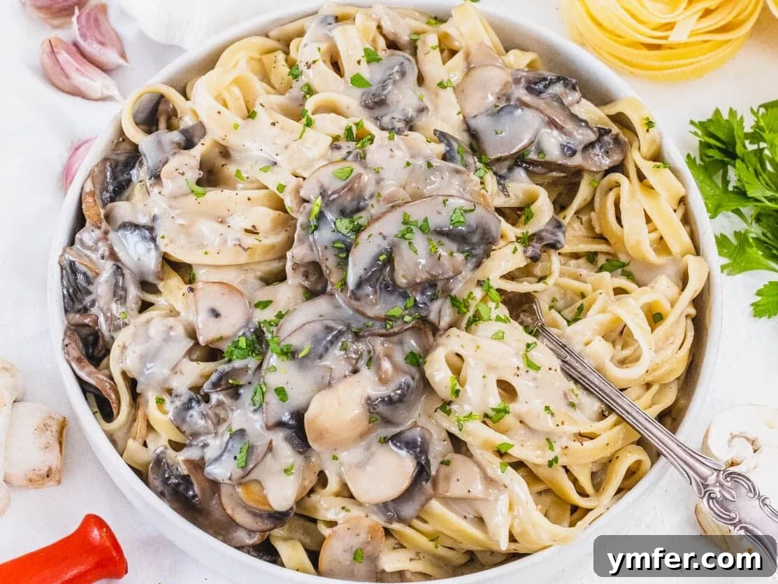 45 Effortless Vegetarian Dinner Ideas 3 Mushroom Alfredo with fork and parsley