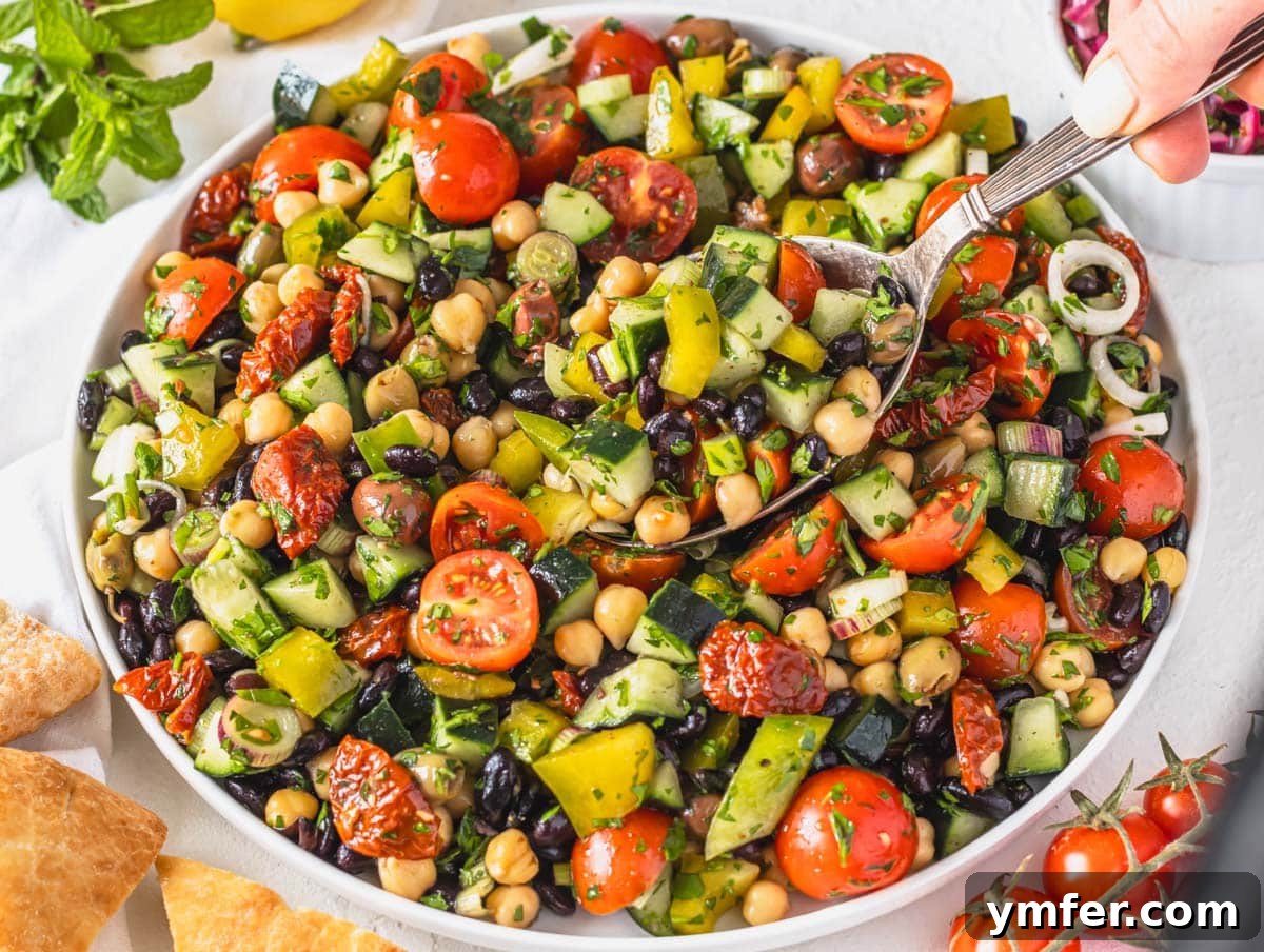 45 Effortless Vegetarian Dinner Ideas 23 Mediterranean salad with chickpeas and black beans on a white plate