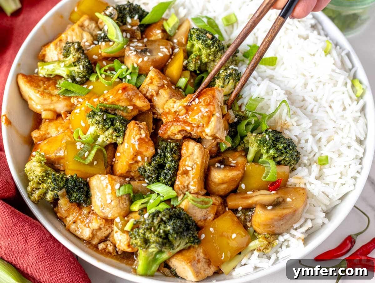45 Effortless Vegetarian Dinner Ideas 35 Louise taking a piece of tofu stir fry with chop sticks