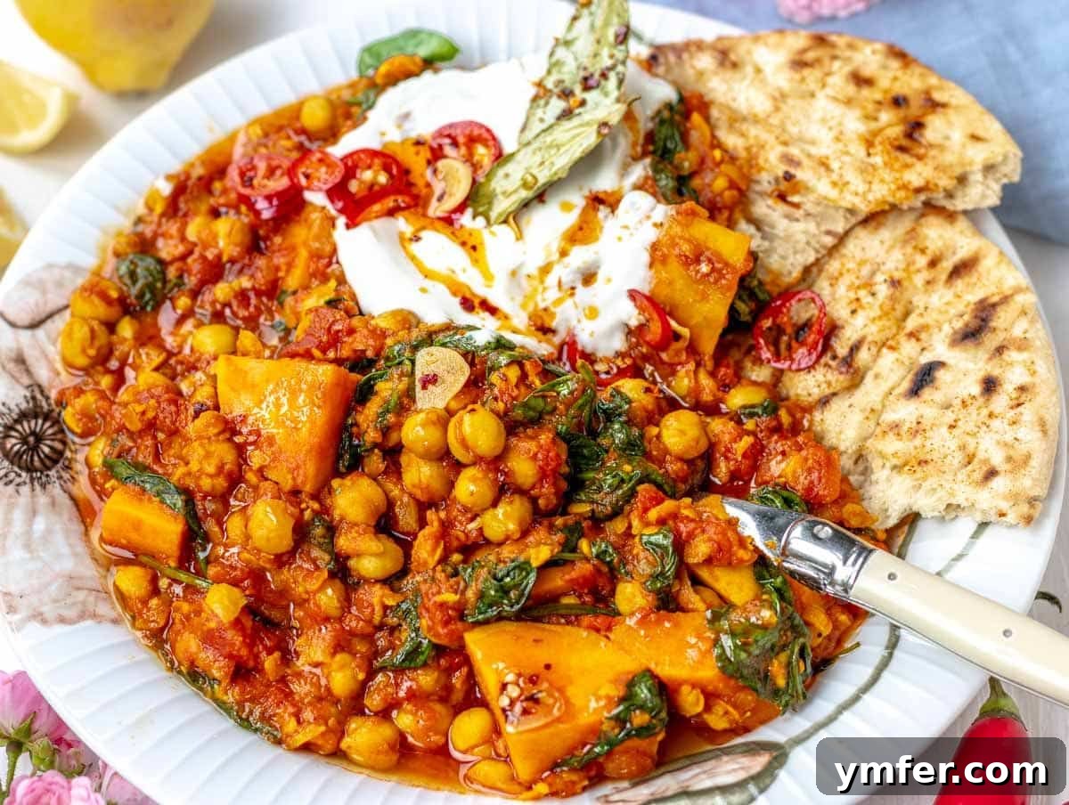 40 Flavorful Plant-Based Dinners 38 Hearty chickpea stew served on a plate with flatbread, yogurt, and a sprinkle of chili flakes.