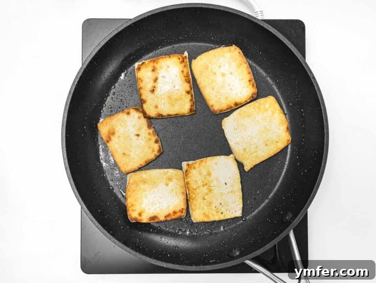 40 Flavorful Plant-Based Dinners 43 Pan fried tofu in a skillet until golden.