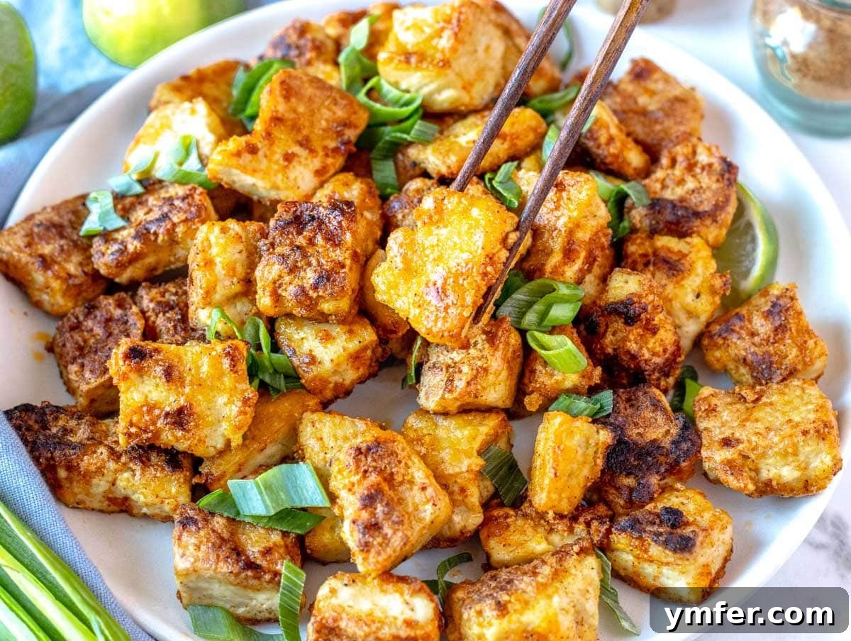 40 Flavorful Plant-Based Dinners 10 Crispy fried tofu served beautifully on a white plate, ready to be enjoyed.