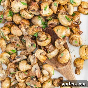 Air fryer mushrooms and spoon in a bowl.