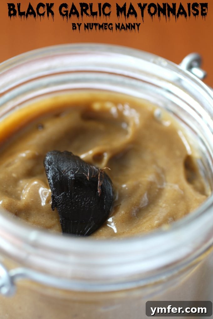 Homemade Black Garlic Mayonnaise A jar of homemade Black Garlic Mayonnaise, showcasing its unique color and creamy texture, ready to be enjoyed.