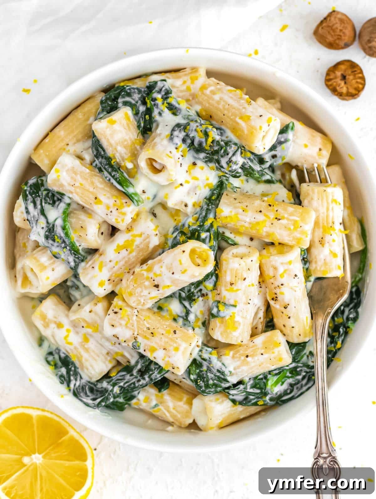 Zesty Lemon Ricotta Pasta 2 A beautifully plated bowl of creamy lemon ricotta pasta with fresh spinach, garnished with lemon zest.