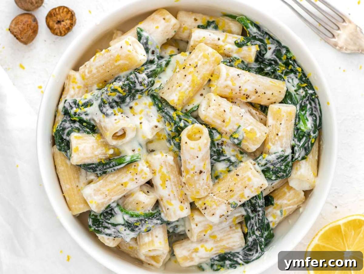 Zesty Lemon Ricotta Pasta 6 Finished lemon ricotta pasta with spinach in a serving bowl, ready to be enjoyed.