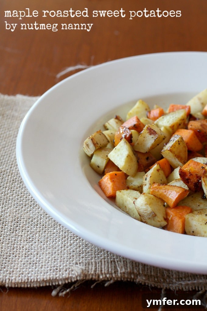 Caramelized Maple Sweet Potatoes 2 Delicious golden maple roasted sweet potatoes seasoned with fresh herbs, ready to be served.