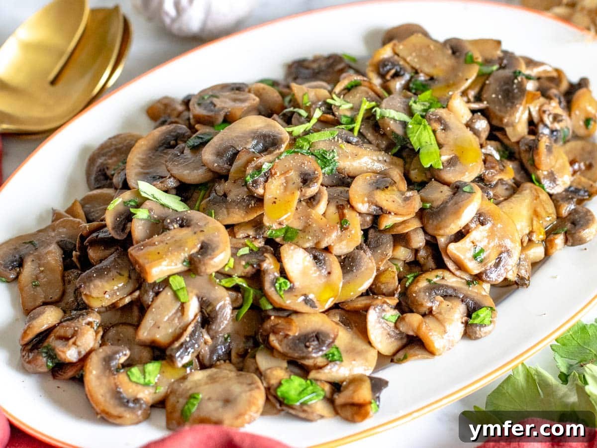 Golden Garlic Mushrooms 3 sauteed mushrooms with parsley served on a white platter