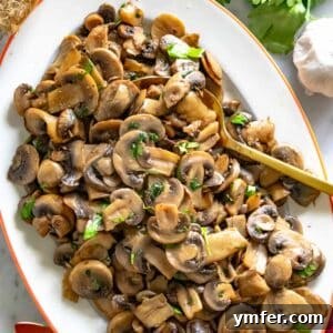 Golden Garlic Mushrooms 22 sauteed mushrooms with a golden spoon and fresh parsley