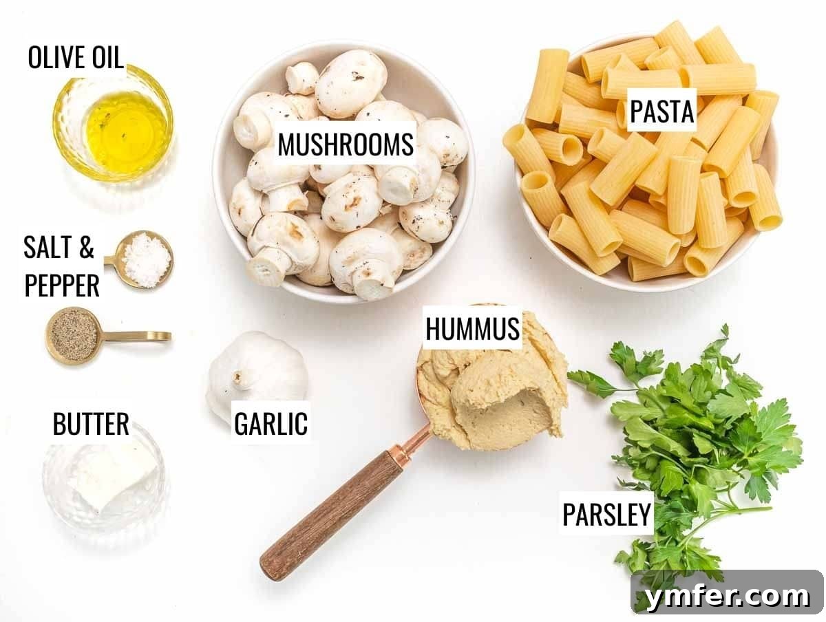 Ingredients laid out for Hummus Pasta: pasta, mushrooms, hummus, garlic, parsley, olive oil, salt, pepper.