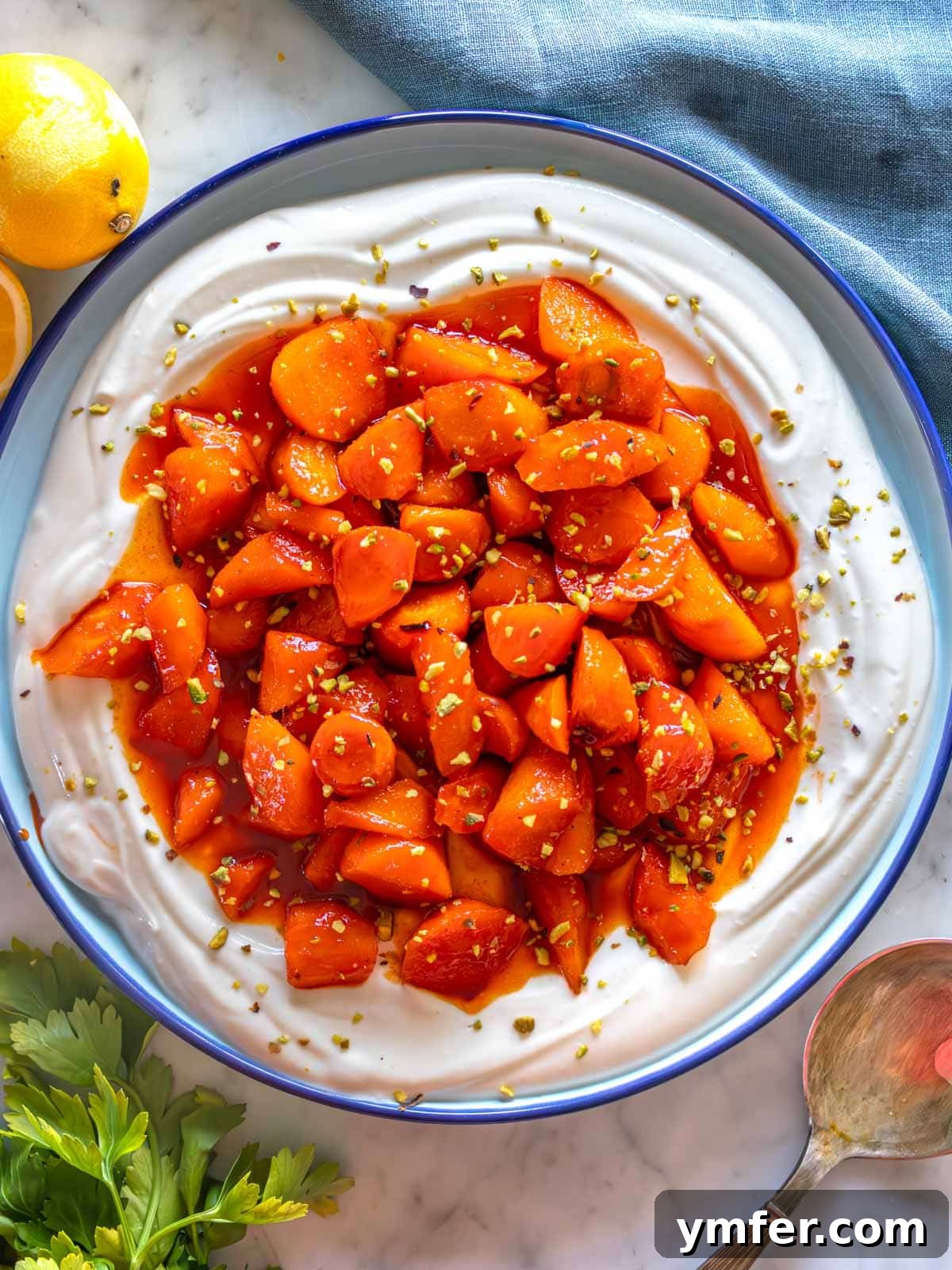 Fiery Honey Glazed Roasted Carrots 2 Hot Honey Glazed Carrots served over a bed of creamy whipped ricotta, garnished with fresh herbs and a drizzle of extra glaze.