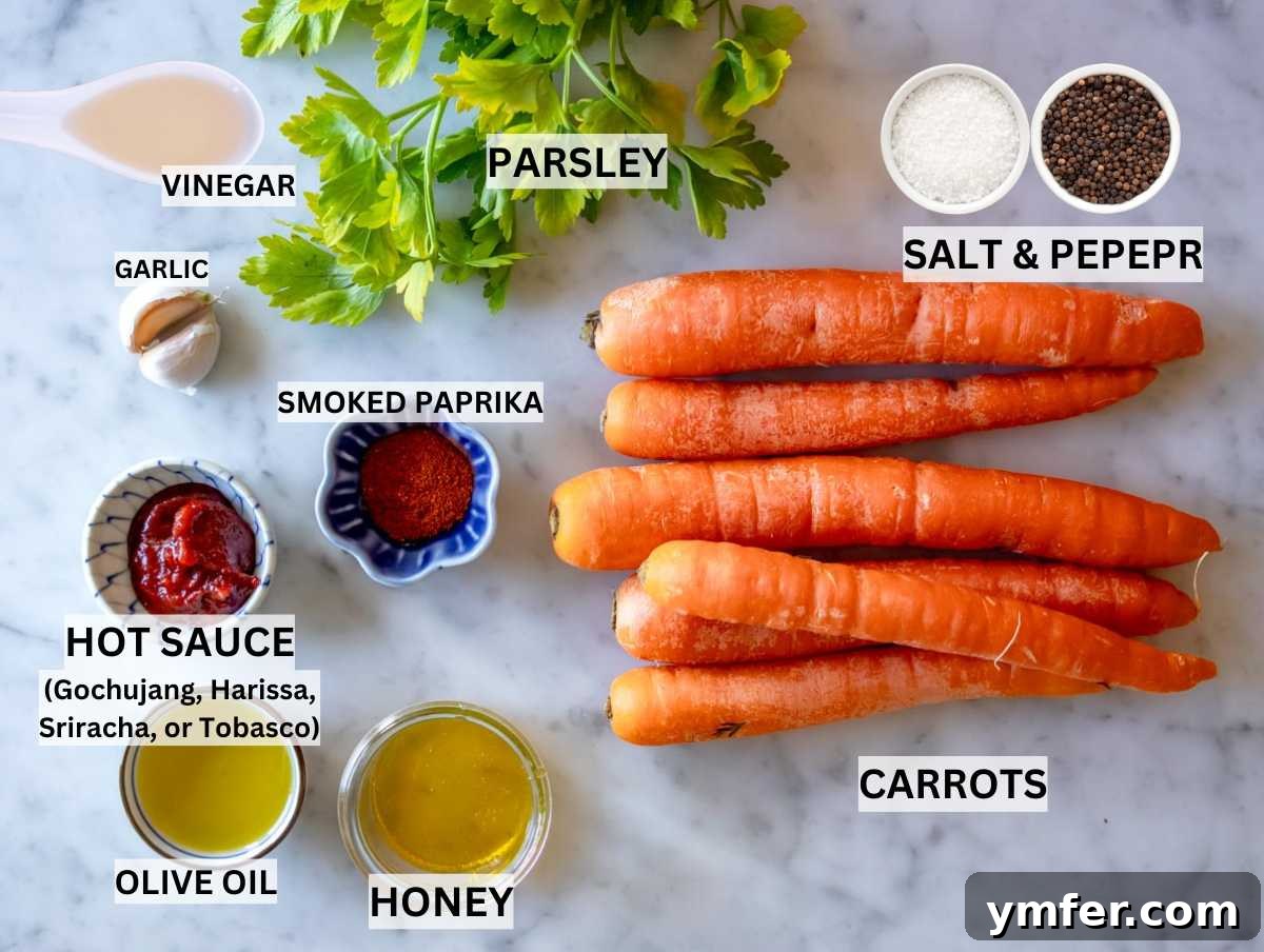 Fiery Honey Glazed Roasted Carrots 3 Fresh carrots, olive oil, garlic, salt, pepper, honey, hot sauce, apple cider vinegar, and smoked paprika arranged on a marble table.