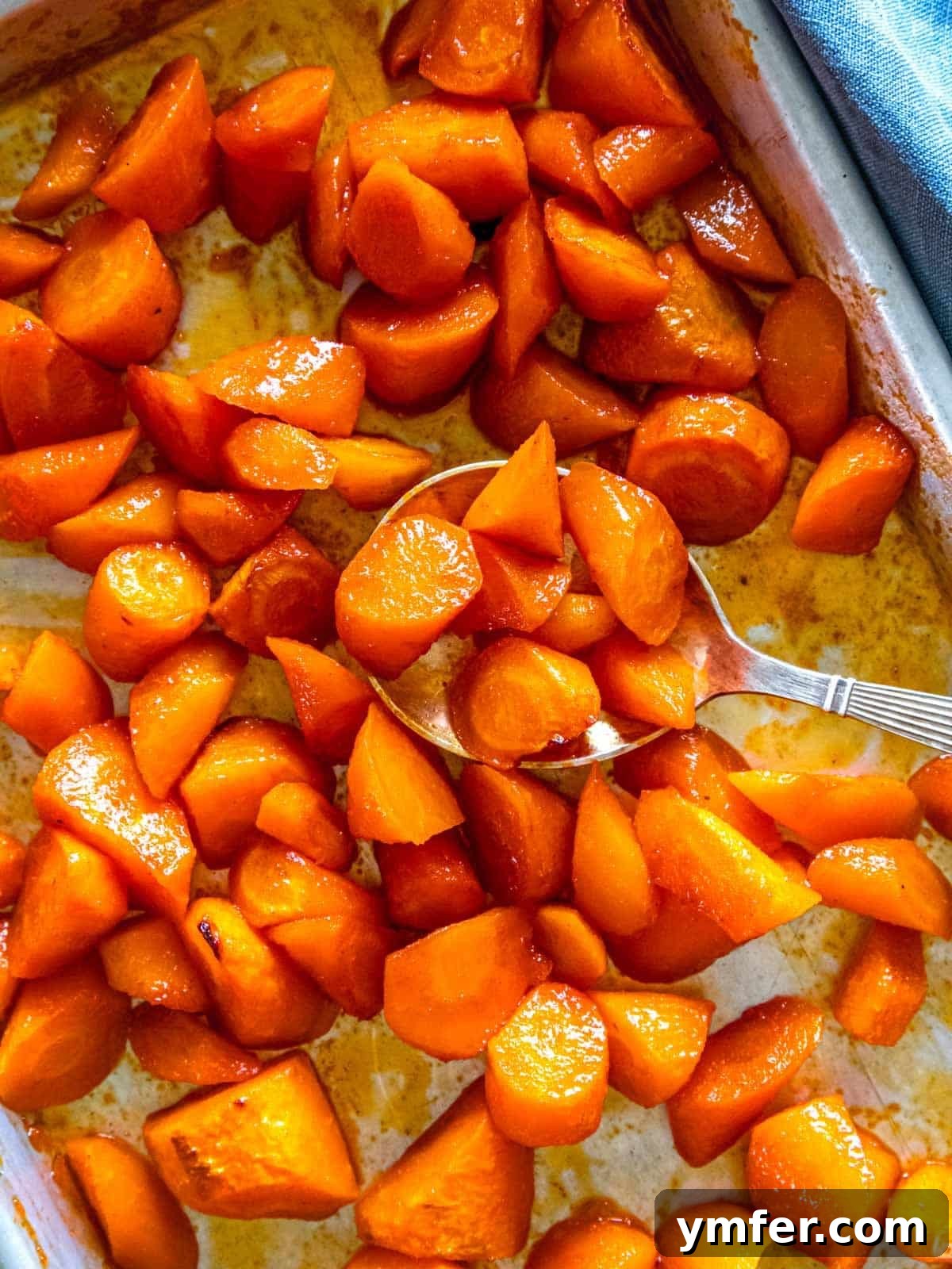 Fiery Honey Glazed Roasted Carrots 4 Close-up of roasted honey carrots, glistening with glaze.