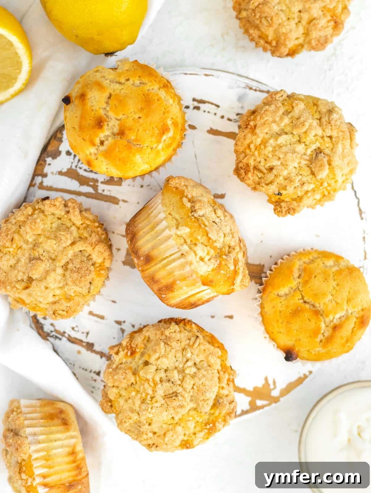 Lemon muffins with streusel topping, showcasing their golden crust and soft texture.